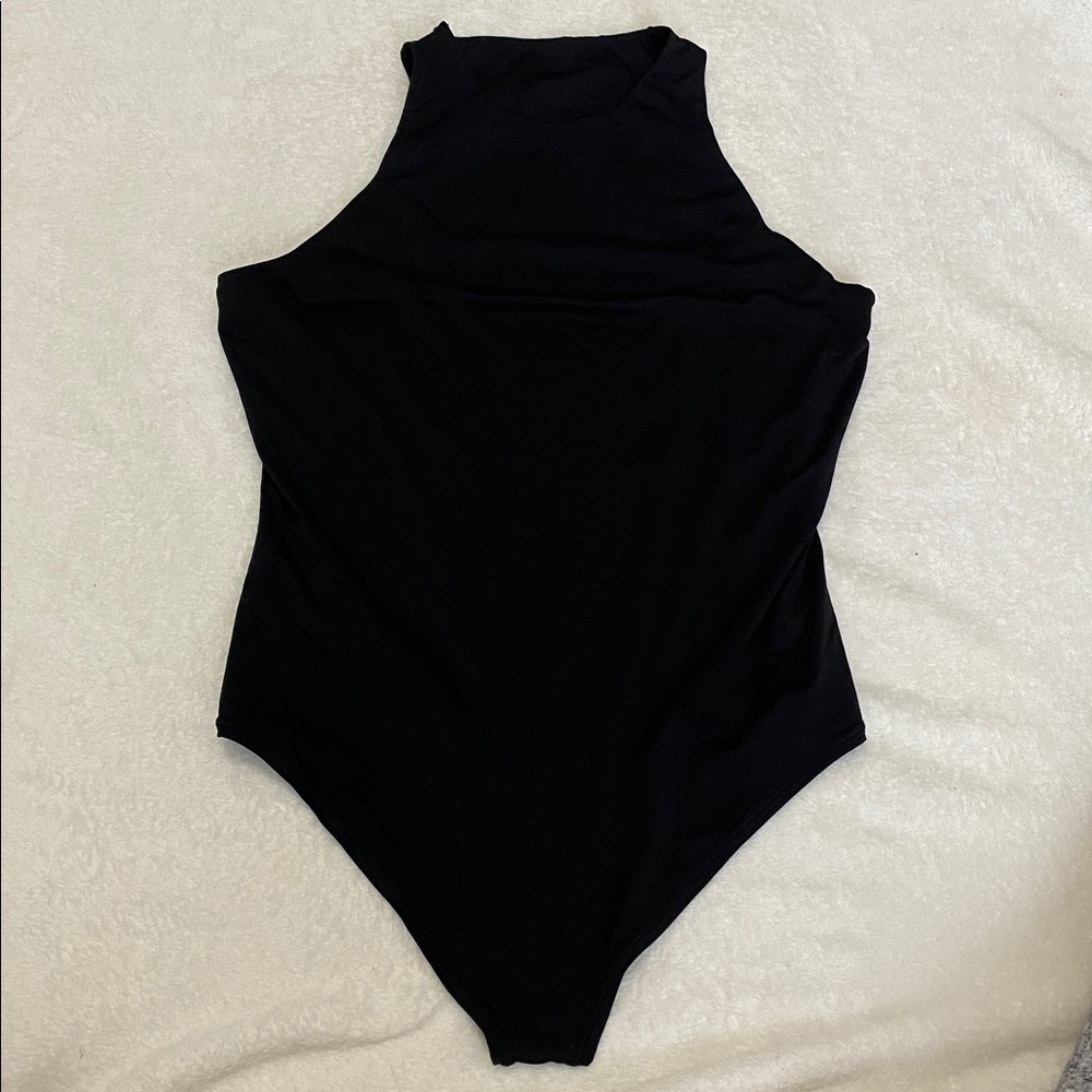 VS Pink XLarge thong body suit in black. High neckline with logo on back. NWOT